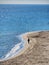 Single unrecognizable lonely silhuette backview walking on a beach