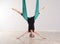 Single upside down woman doing aerial yoga splits