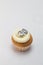 Single vanilla sponge cup cake with silver glitter number 30 on