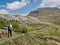 A single walker heading for Ingleborough in the Yorkshire Dales, UK