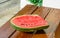 Single watermelon cut on table