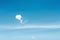 Single white clouds in  heart shaped balloon patterns concept floating on bright bluesky  background , copy space