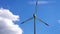 Single Wind Turbine Spins Under Blue Skies