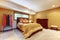 Single woman asian master bedroom interior with yellow walls.