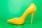 Single yellow high heels