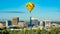 Single yellow hot air balloon over the city of Boise Idaho