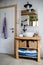 Sink, mirror and wooden cupboard in bathroom at home.