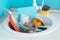 Sink with a pile of dirty dishes. Complete washing of crockery, tableware.