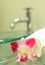Sink, towels and orchid