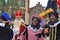 Sinterklaas arriving on his Steamboat with his black helpers (Zwarte Pieten)