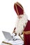 Sinterklaas using a laptop