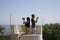 Sintra, Portugal, August 25, 2018: Young people take photos on the phone and camera from the tower. The girl and the young man