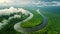 A sinuous river winds its way through a lush green forest, creating a dynamic and captivating scene, A winding river through the