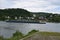 Sinzig, Germany - 07 02 2020: cargo ship and train passing village Leubsdorf at the Rhine