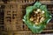 Siomay - Indonesian dish with steamed fish dumpling and vegetables served in peanut sauce in banana leaf - copy space left