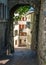 Sion old town vertical view with scenic pedestrian laneway with paved street and medieval arch and buildings in Sion Switzerland