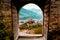 Sion, Switzerland: Medieval Valere basilica seen through main gates of Tourbillon Castle located in canton Valais