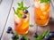 Sip of Serenity: Mini Peach Tea with Ice, Mint, and Blueberry - A Vegan Delight