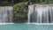 SIQUIJOR, PHILIPPINES - FEBRUARY 9, 2018: People enjoy Cambugahay Falls on Siquijor island, Philippines.