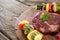 Sirloin chop with skewered vegetables on wooden tray