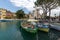 Sirmione - Italian small city on Garda lake with boats and castle