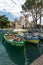 Sirmione - Italian small city on Garda lake with boats and castle
