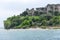 Sirmione, Italy - April 29, 2018: Amazing panoramic view of Grotte di Catullo from the Garda Lake