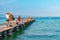SIRMIONE, ITALY, JULY 21, 2019: People are enjoying a sunny day at pier at Lido delle Bionde beach at Sirmione, Italy
