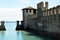 Sirmione Scaliger Castle with moat, rare example of medieval port fortification, Sirmione, Lake Garda, Italy