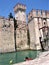 Sirmone castle in the water of Lake Garda