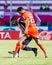 SISAKET THAILAND-AUGUST 3: Victor Amaro of Sisaket FC. (orange)