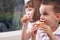 Sister and Brother Eating an Apple