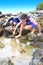 Sister and brother by a tropical rockpool