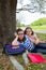 Sister firends girls relaxed under tree park after school