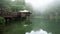Sister pond in Alishan national scenic area in Taiwan. Panoramic view of lake with gazebo in foggy weather