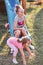 Sisters having fun on a slide together