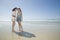 Sisters looking at shell on beach