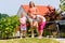 Sisters playing bocce in garden front or their home