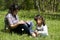 Sisters reading book together