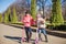 sisters ride scooters on a warm sunny spring day