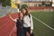 Sisters take selfie on sports field