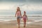 Sisters walking on the beach