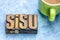 Sisu Finnish concept - word in wood type