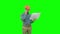 Site manager talking on the phone holding blueprints on a Green Screen, Chroma Key.