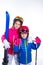 Siters kid girls with ski poles helmet and snow goggles