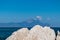 Sithonia - Rock formation with scenic view of holy Mount Athos from Fava sand beach near Vourvourou, Greek peninsula Sithonia