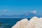 Sithonia - Rock formation with scenic view of holy Mount Athos from Fava sand beach near Vourvourou, Greek peninsula Sithonia