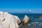 Sithonia - Rock formation with scenic view of holy Mount Athos from Fava sand beach near Vourvourou, Greek peninsula Sithonia