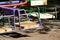 Sitting bright children`s swing on playground closeup