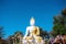 Sitting Buddha image on bright blue sky view background at  phra that doi khum  temple in Chiang Mai of Thailand